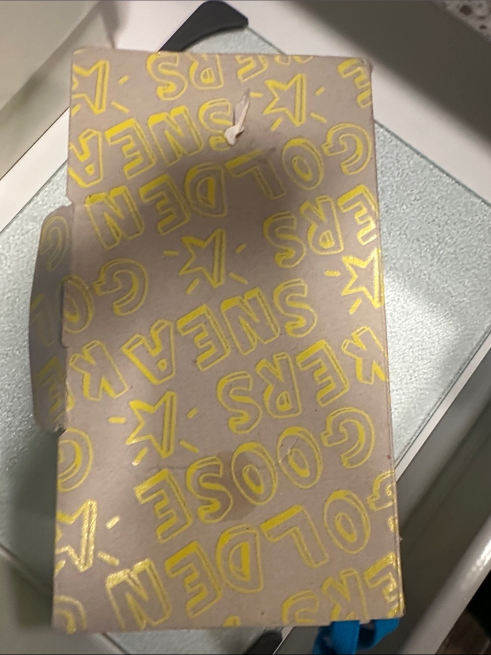 Golden Goose beige box with yellow logo pattern